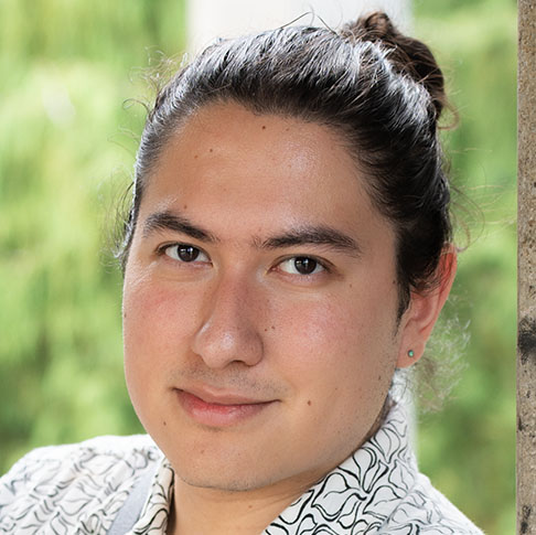 Portrait of a young man smiling outdoors, Ou Lab Research People UCSF Yvonne.
