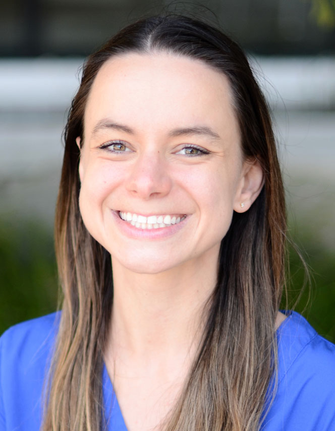 Smiling woman with long hair.