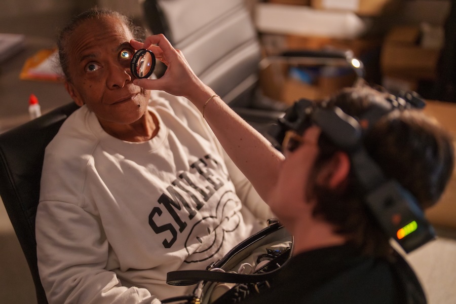 Adult woman receiving eye examination.