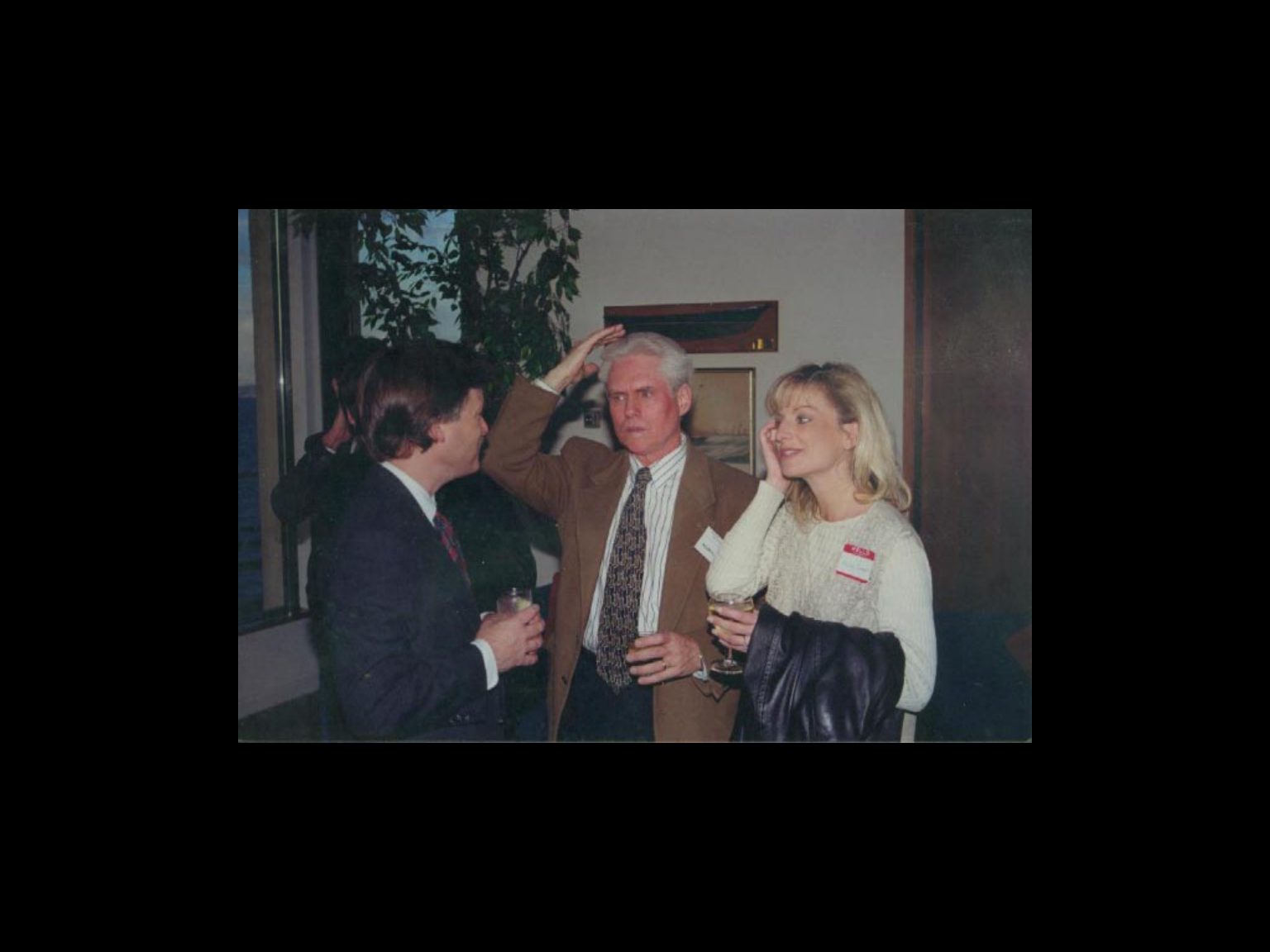Archival photograph 12 from the 1999, 40th reunion of the Frederick C. Cordes Eye Society., showing Frederick C. Cordes Eye Society members at a reunion or banquet event.