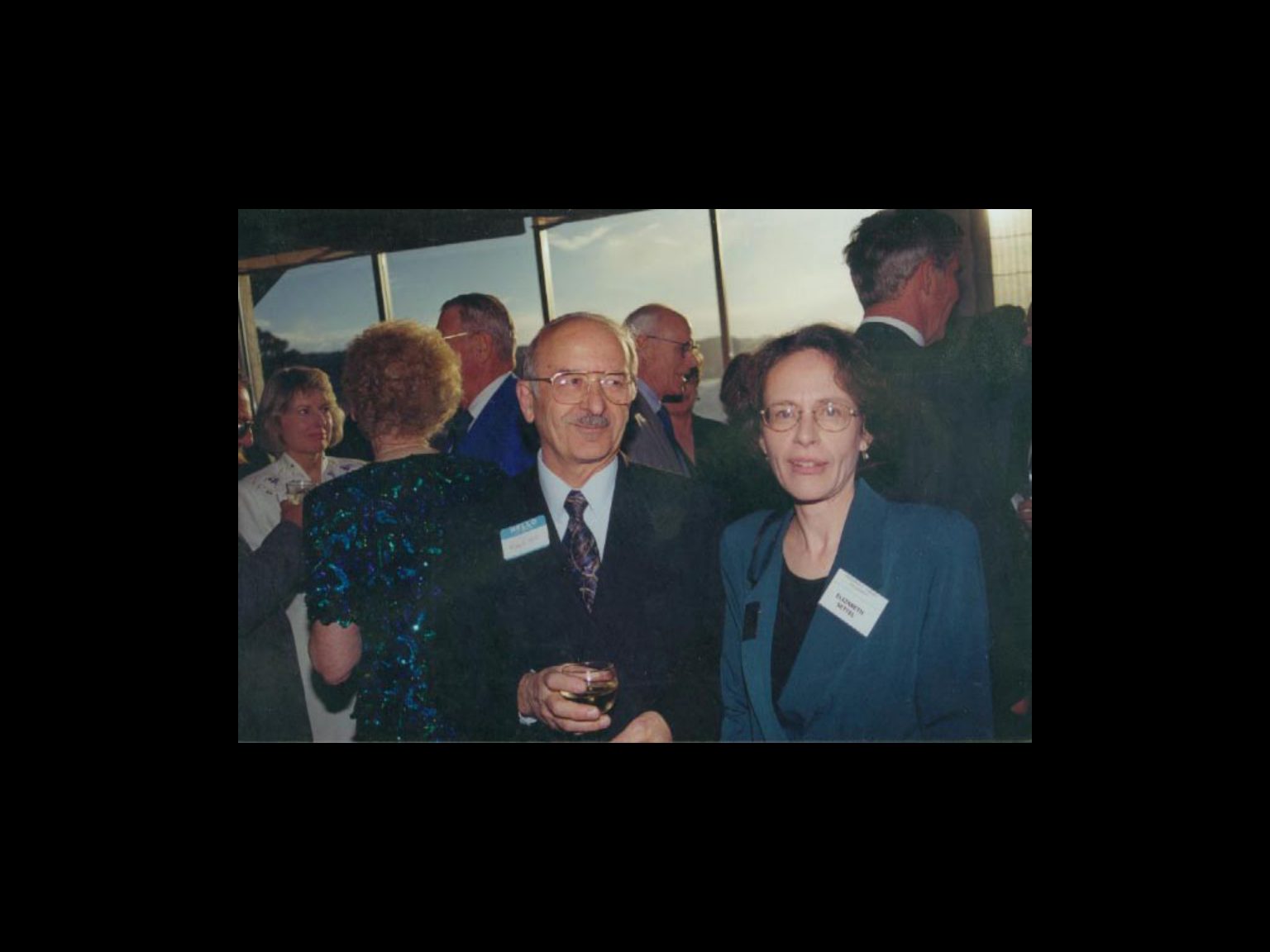 Archival photograph 18 from the 1999, 40th reunion of the Frederick C. Cordes Eye Society., showing Frederick C. Cordes Eye Society members at a reunion or banquet event.