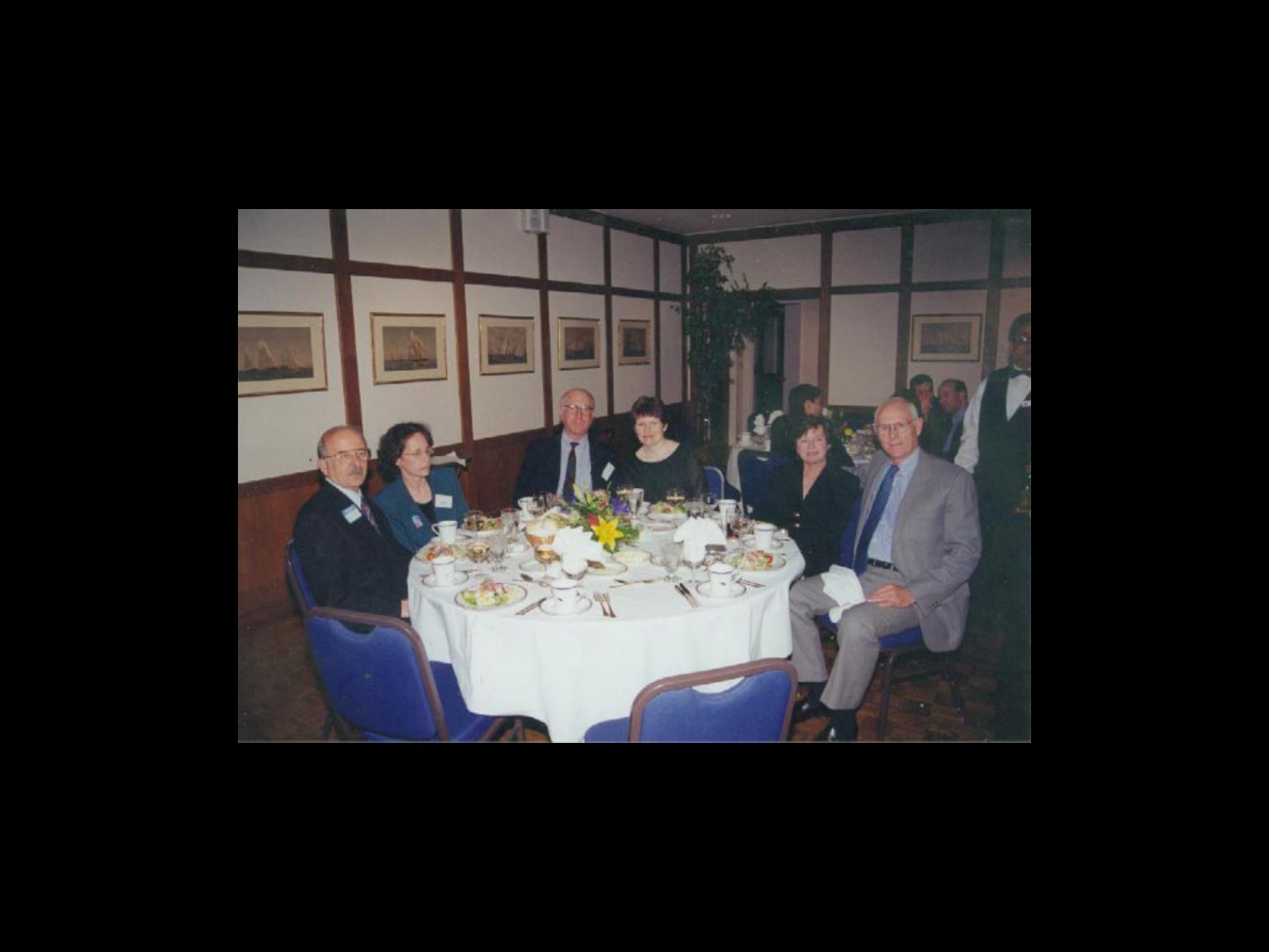 Archival photograph 32 from the 1999, 40th reunion of the Frederick C. Cordes Eye Society., showing Frederick C. Cordes Eye Society members at a reunion or banquet event.