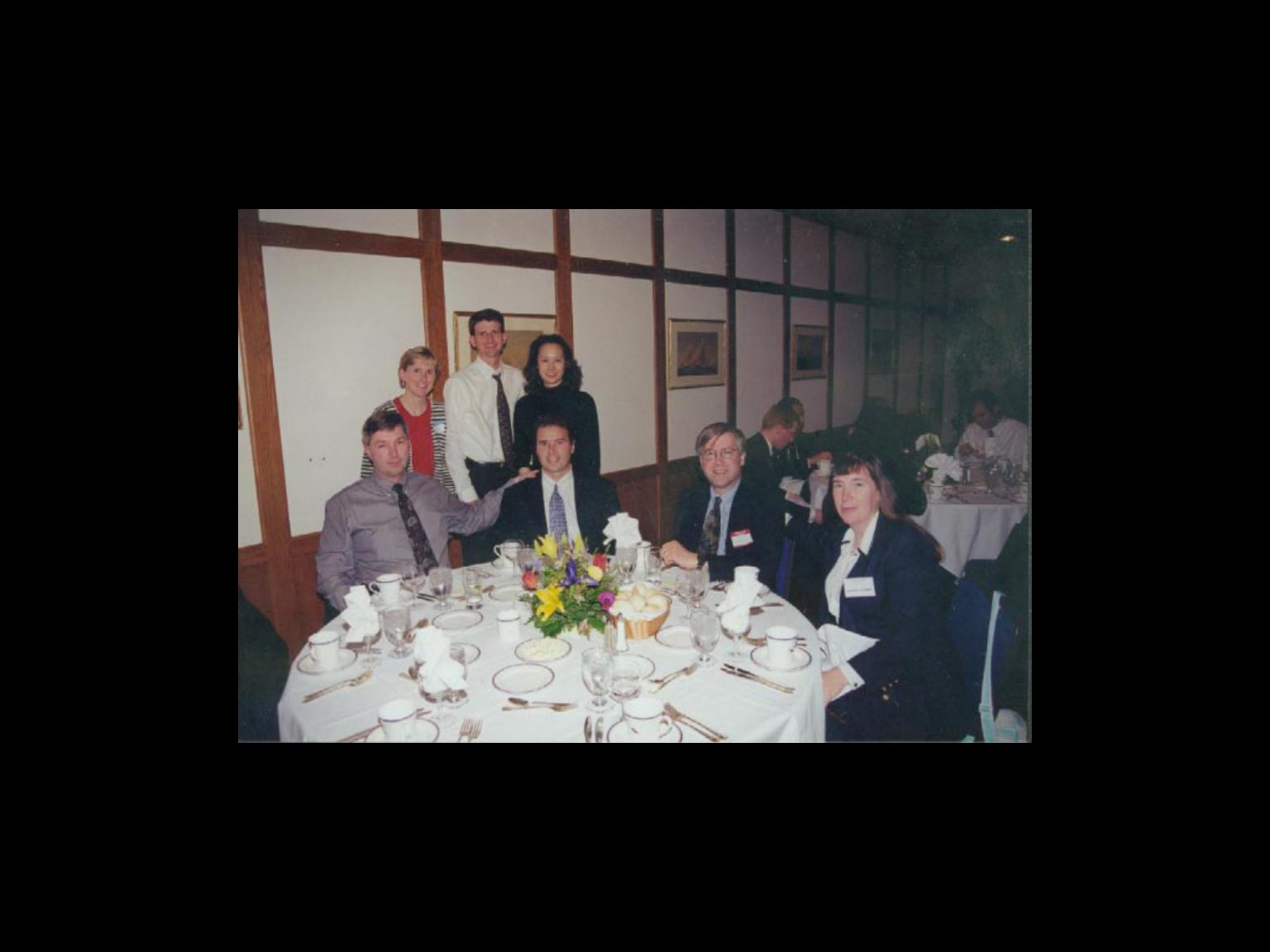 Archival photograph 33 from the 1999, 40th reunion of the Frederick C. Cordes Eye Society., showing Frederick C. Cordes Eye Society members at a reunion or banquet event.