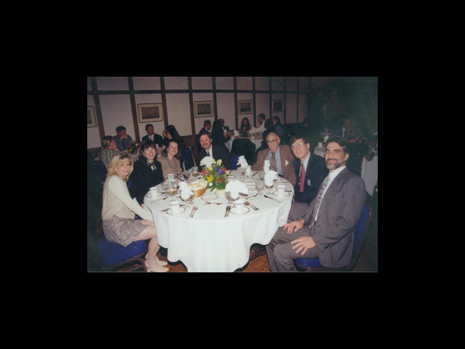 Archival photograph 34 from the 1999, 40th reunion of the Frederick C. Cordes Eye Society., showing Frederick C. Cordes Eye Society members at a reunion or banquet event.