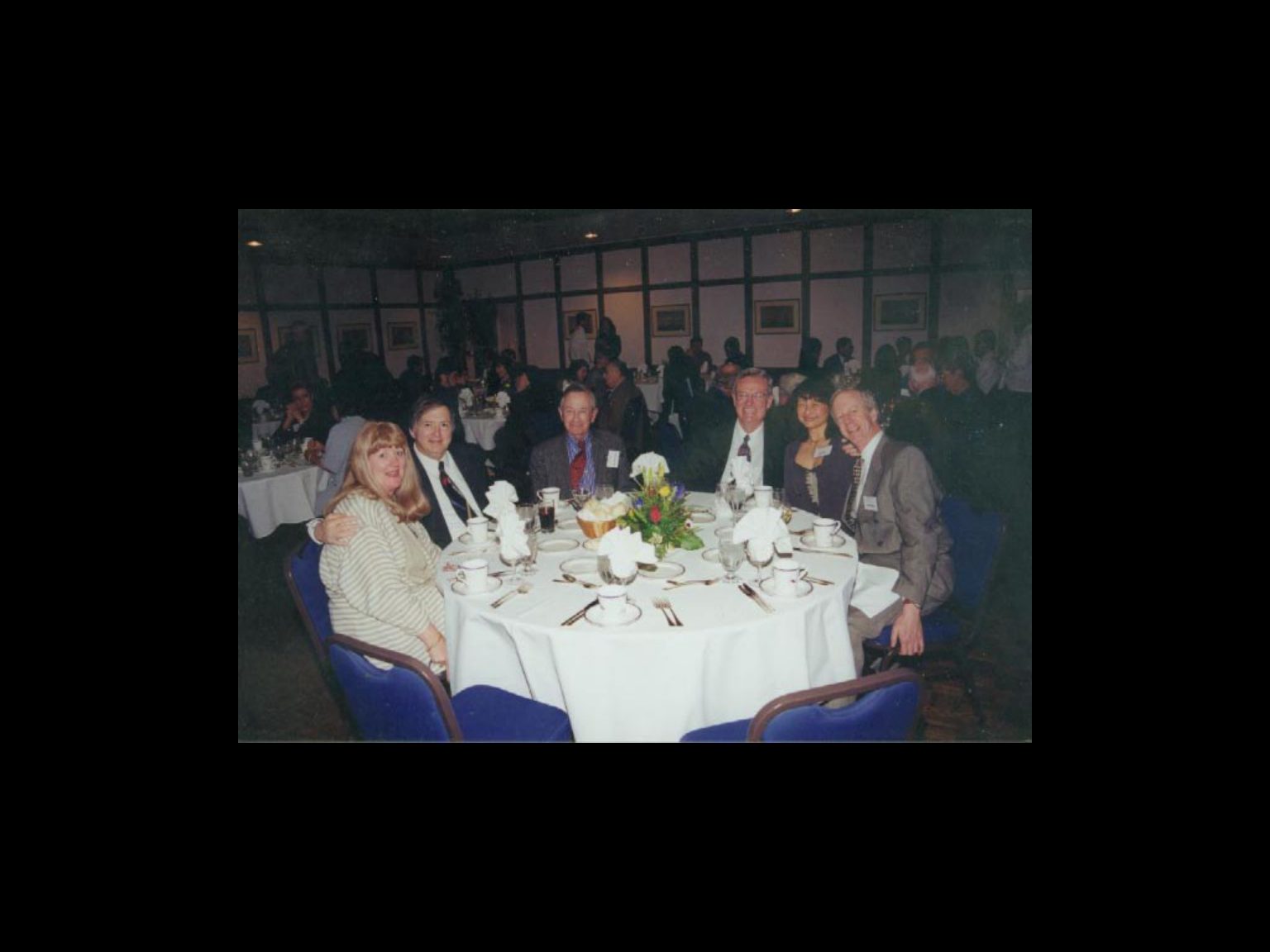 Archival photograph 37 from the 1999, 40th reunion of the Frederick C. Cordes Eye Society., showing Frederick C. Cordes Eye Society members at a reunion or banquet event.