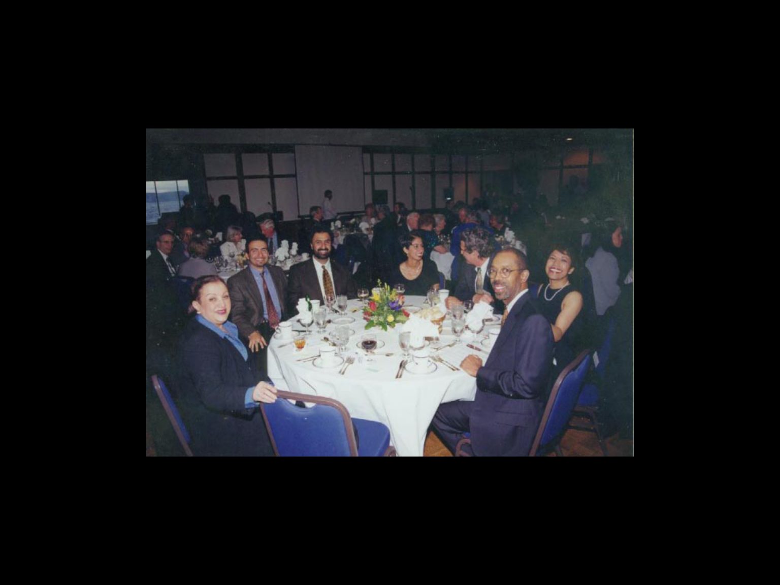 Archival photograph 38 from the 1999, 40th reunion of the Frederick C. Cordes Eye Society., showing Frederick C. Cordes Eye Society members at a reunion or banquet event.