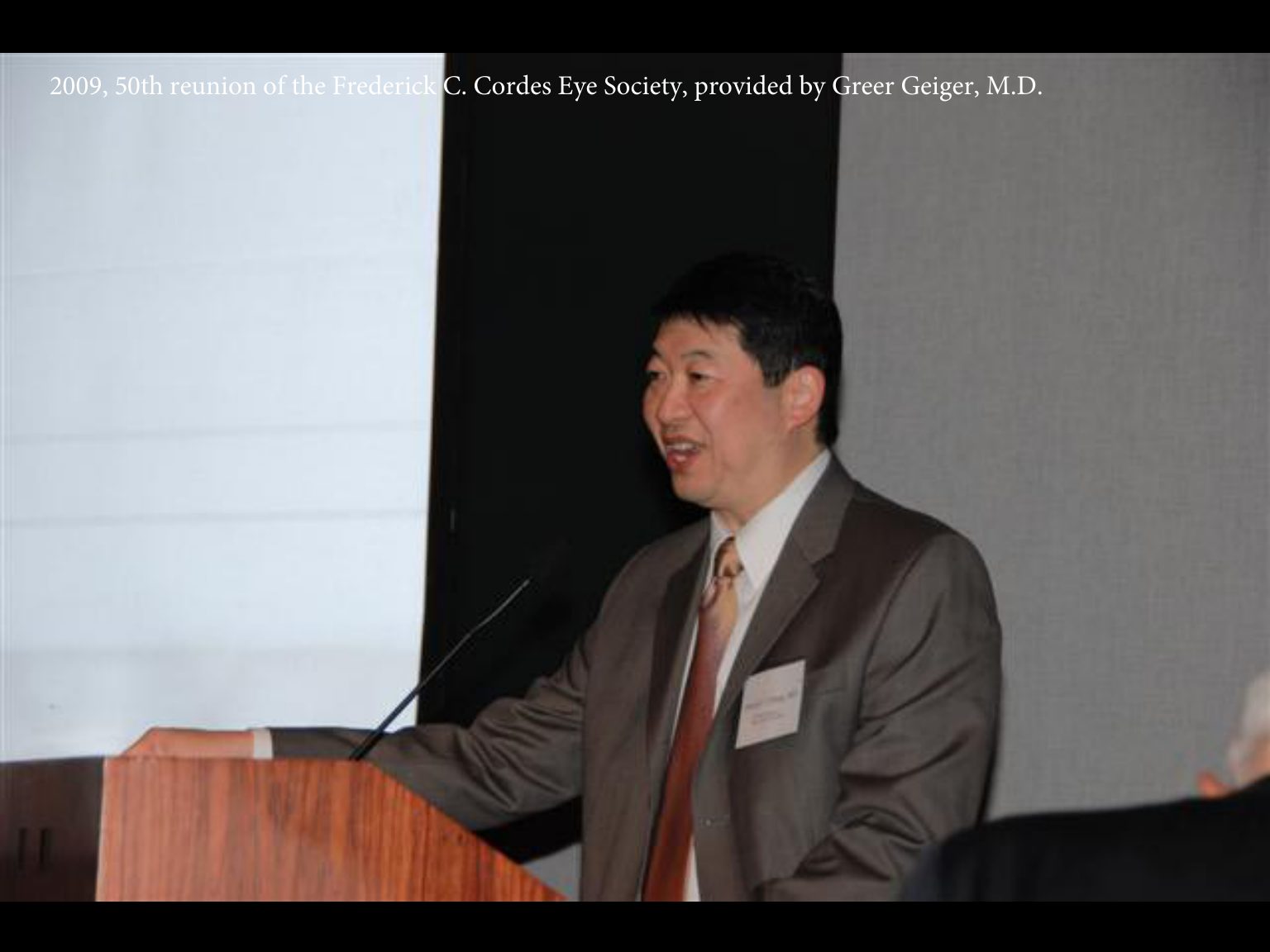 Archival photograph 1 from the 2009, 50th reunion of the Frederick C. Cordes Eye Society, provided by Greer Geiger, M.D., showing Frederick C. Cordes Eye Society members at a reunion or banquet event.