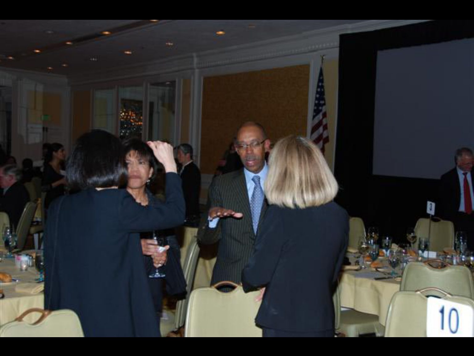 Archival photograph 77 from the (part two) from the 2009, 50th reunion of the Frederick C. Cordes Eye Society provided by Greer Geiger, M.D., showing Frederick C. Cordes Eye Society members at a reunion or banquet event.